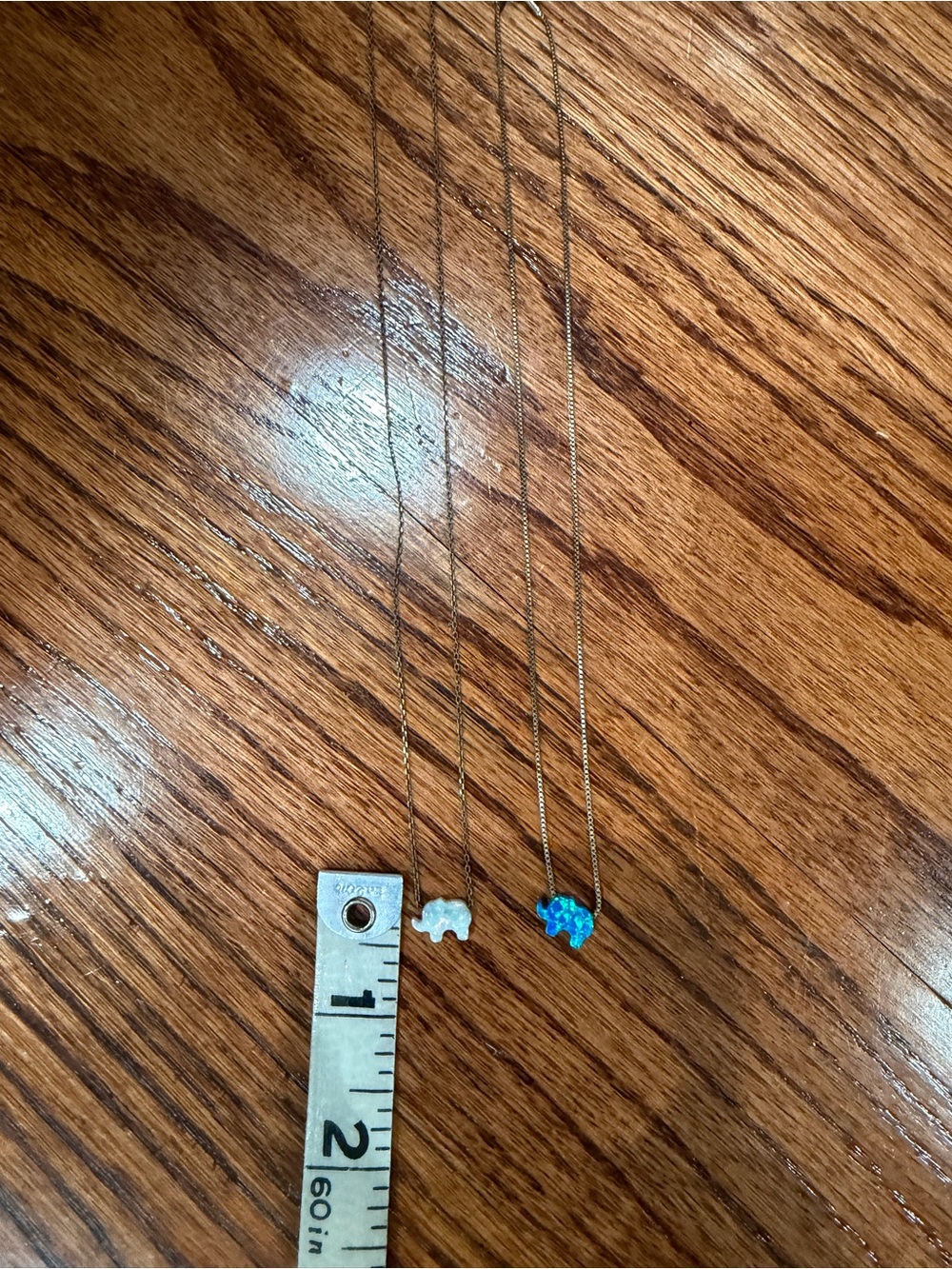 Sterling silver necklace with Blue Opal and White Opal elephants